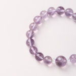 Mystical Realm of Purple Glow-Beaded Bracelet