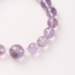 Mystical Realm of Purple Glow-Beaded Bracelet